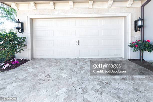 architecture: brand new house with a garage - empty driveway stock pictures, royalty-free photos & images