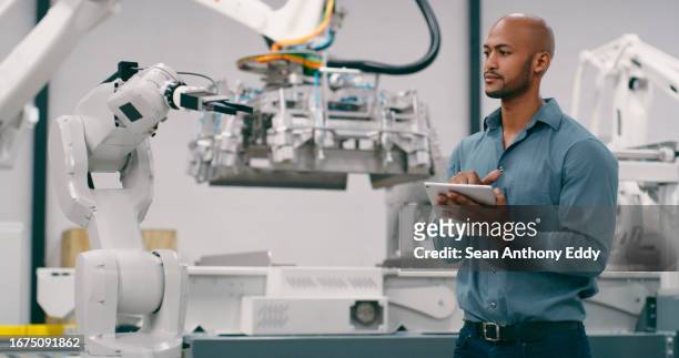 tablet, robot and engineering with man in factory for engineering, futuristic and production. inspection, technology and machine maintenance with person for manufacturing, industry 4.0 or electronics - industry 4 0 imagens e fotografias de stock