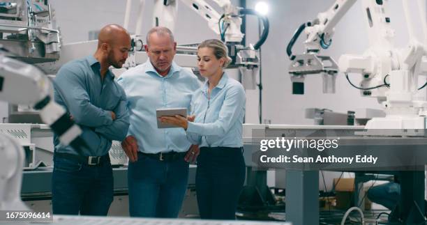 engineer, teamwork and tablet for programming in robotics, people at factory and high tech innovation in industry. automation, collaboration and inspection of robot, engineering and machine learning - developer stock pictures, royalty-free photos & images