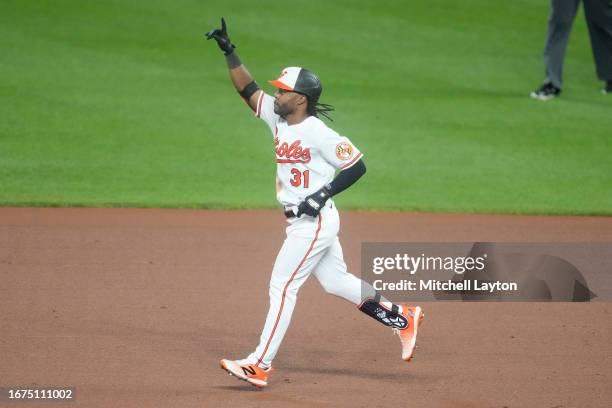 Cedric Mullins of the Baltimore Orioles celebrates hitting a grand slam in the fifth inning during a baseball game against the St. Louis Cardinals at...