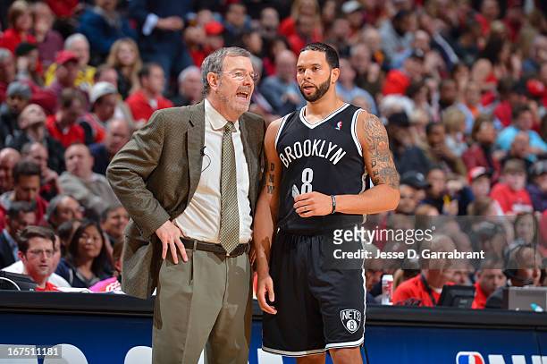 Brooklyn Nets Interim Head Coach P.J. Carlesimo speaks with Deron Williams while playing against the Chicago Bulls in Game Three of the Eastern...