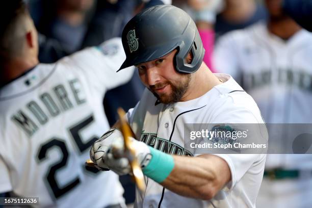 Cal Raleigh of the Seattle Mariners celebrates his two run home run against the Los Angeles Angels during the first inning at T-Mobile Park on...