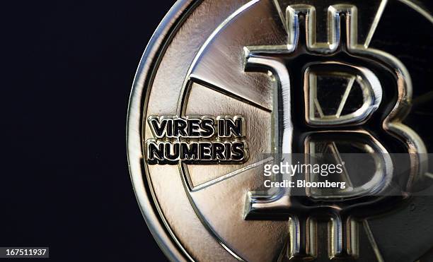 Twenty-five bitcoin is arranged for a photograph in Tokyo, Japan, on Thursday, April 25, 2013. The digital currency, which carries the unofficial...