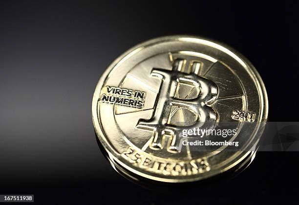 Twenty-five bitcoin is arranged for a photograph in Tokyo, Japan, on Thursday, April 25, 2013. The digital currency, which carries the unofficial...