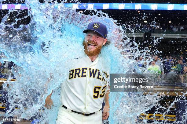 Brandon Woodruff of the Milwaukee Brewers is doused following a game against the Miami Marlins at American Family Field on September 11, 2023 in...