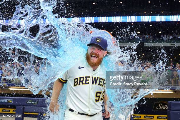Brandon Woodruff of the Milwaukee Brewers is doused following a game against the Miami Marlins at American Family Field on September 11, 2023 in...