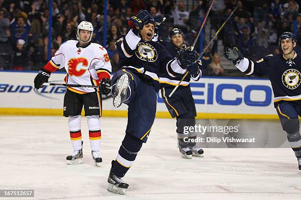 Ryan Reaves of the St. Louis Blues celebrates his second goal of the game against the Calgary Flames during the third period at the Scottrade Center...