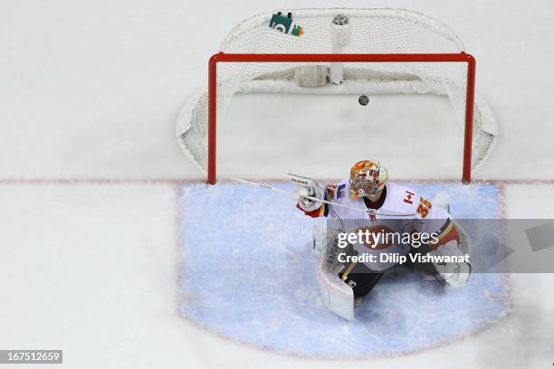 Joey MacDonald of the Calgary Flames allows a goal against the St. Louis Blues during the first period at the Scottrade Center on April 25, 2013 in...