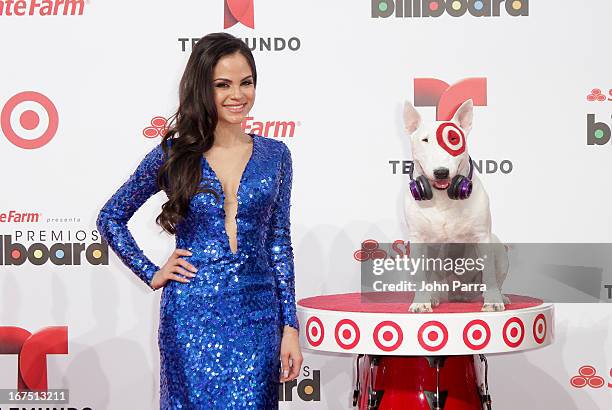 Natty Natasha celebrates with Bullseye, Target's Beloved Bull Terrier Mascot, at the 2013 Billboard Latin Music Awards at BankUnited Center on April...