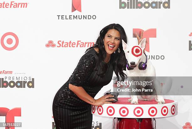 Litzy celebrates with Bullseye, Target's Beloved Bull Terrier Mascot, at the 2013 Billboard Latin Music Awards at BankUnited Center on April 25, 2013...