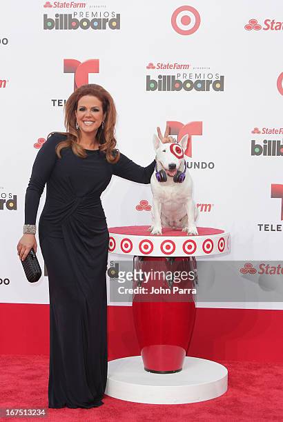 Maria Celeste Arraras celebrates with Bullseye, Target's Beloved Bull Terrier Mascot, at the 2013 Billboard Latin Music Awards at BankUnited Center...
