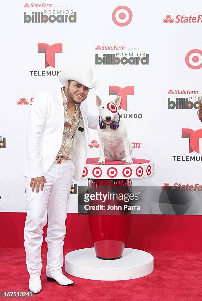 Geraldo Ortiz celebrates with Bullseye, Target's Beloved Bull Terrier Mascot, at the 2013 Billboard Latin Music Awards at BankUnited Center on April...