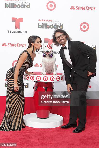 Catherine Siachoque and Miguel Varoni celebrates with Bullseye, Target's Beloved Bull Terrier Mascot, at the 2013 Billboard Latin Music Awards at...