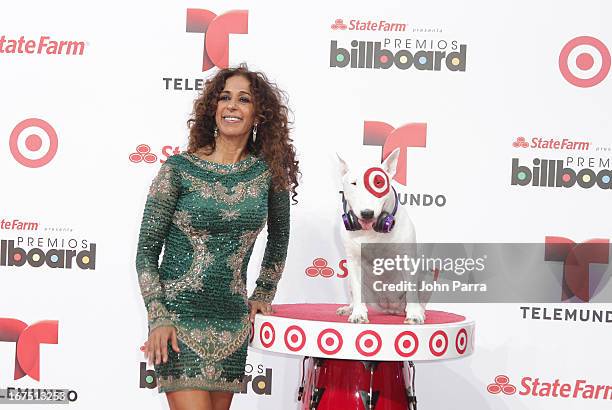Rosario celebrates with Bullseye, Target's Beloved Bull Terrier Mascot, at the 2013 Billboard Latin Music Awards at BankUnited Center on April 25,...