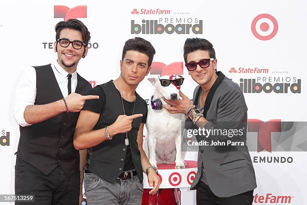 Il Volo celebrates with Bullseye, Target's Beloved Bull Terrier Mascot, at the 2013 Billboard Latin Music Awards at BankUnited Center on April 25,...