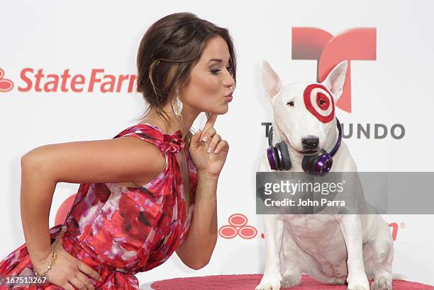 Kimberly Dos Ramos celebrates with Bullseye, Target's Beloved Bull Terrier Mascot, at the 2013 Billboard Latin Music Awards at BankUnited Center on...