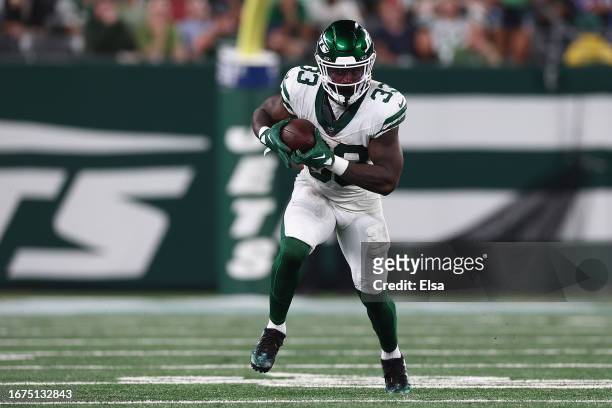 Running back Dalvin Cook of the New York Jets rushes the football against the Buffalo Bills during the third quarter of the NFL game at MetLife...
