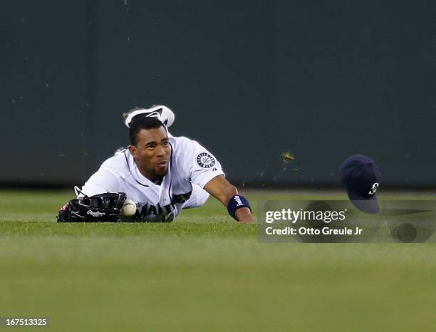 Center fielder Endy Chavez of the Seattle Mariners just misses making a diving catch on a ball hit by Luis Jimenez of the Los Angeles Angels of...