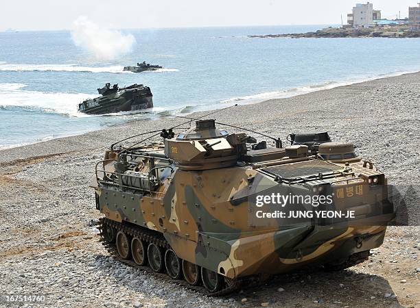 South Korea and US Marine amphibious assault vehicles land on the seashore during a joint landing operation by US and South Korean Marines in Pohang,...