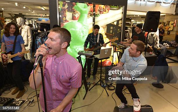 Marc Griffin and Tyler Cordy of the band 2AM Club perform as Sportiqe and ESPN host a NBA Playoff Party at Bloomingdale's 59th Street Store on April...