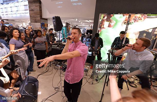 Marc Griffin and Tyler Cordy of the band 2AM Club perform as Sportiqe and ESPN host a NBA Playoff Party at Bloomingdale's 59th Street Store on April...