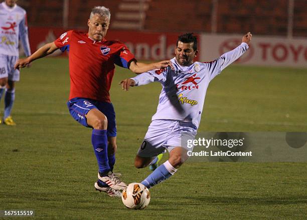Fabio Ramos of Real Garcilaso fights for the ball with Israel Damonte of Nacional during the match between Real Garcilaso of Peru and Nacional of...
