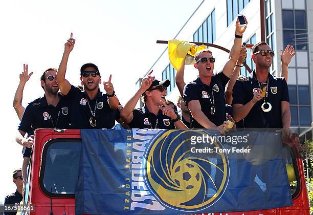 Mariners players wave to fans during the Central Coast Mariners A-League grand Final celebrations on April 26, 2013 in Gosford, Australia.