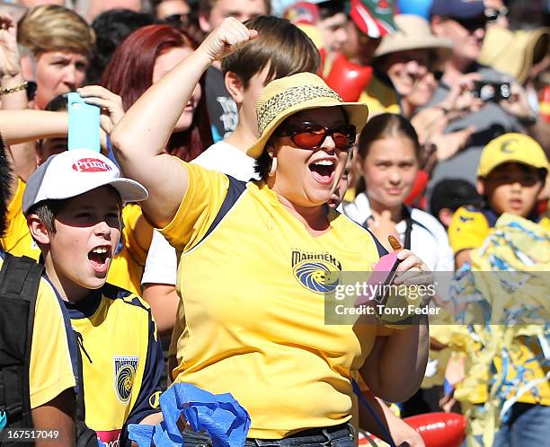 Mariners fans wave to the players during the Central Coast Mariners A-League grand Final celebrations on April 26, 2013 in Gosford, Australia.