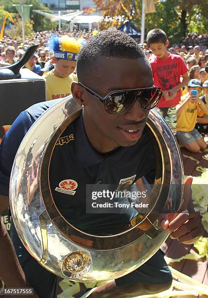 Bernie Ibini of the Mariners poses with the A-League trophy during the Central Coast Mariners A-League grand Final celebrations on April 26, 2013 in...