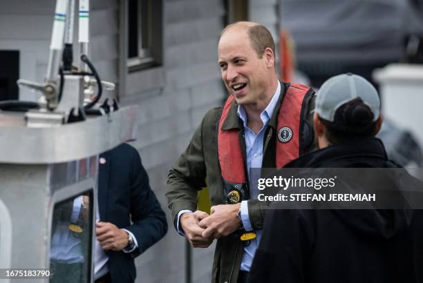 Britain's Prince William, Prince of Wales, arrives at a waiting boat ahead of a trip to meet students from the Urban Assembly New York Harbor School...