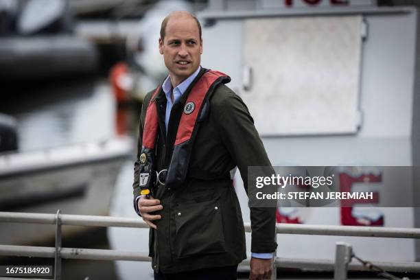 Britain's Prince William, Prince of Wales, arrives at a waiting boat ahead of a trip to meet students from the Urban Assembly New York Harbor School...