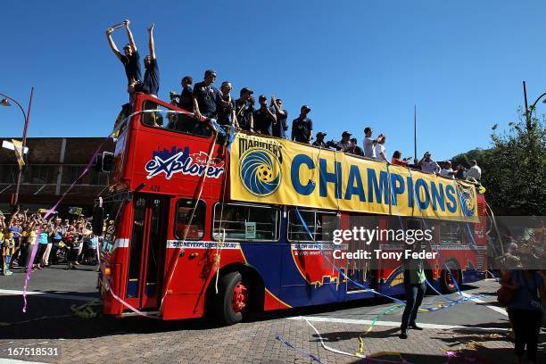 Mariners players wave to fans during the Central Coast Mariners A-League grand Final celebrations on April 26, 2013 in Gosford, Australia.