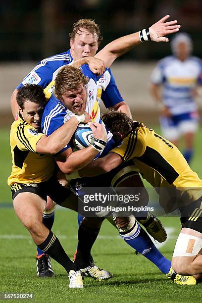 Duane Vermeulen of the Stormers is tackled during the round 11 Super Rugby match between the Hurricanes and the Stormers at FMG Stadium on April 26,...