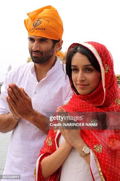 Indian Bollywood actor Aditya Roy Kapoor and actress Shraddha Kapoor pose for a photo near the Sikh Shrine the Golden temple in Amritsar on April 26,...