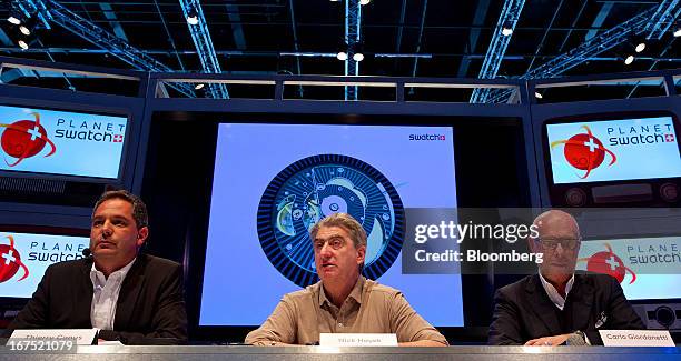 Thierry Conus, director of research and development at ETA SA Manufacture Horlogere Suisse, left, Nick Hayek, chief executive officer of Swatch Group...