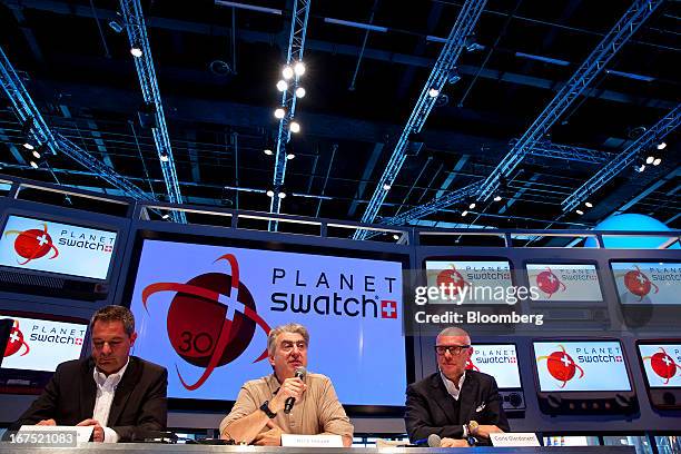 Thierry Conus, director of research and development at ETA SA Manufacture Horlogere Suisse, left, Nick Hayek, chief executive officer of Swatch Group...