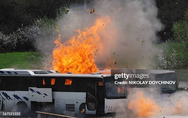 Two buses explode on April 26, 2013 as investigators re-enact the July 2012 Burgas airport bus bombing that killed five Israeli tourists near the...