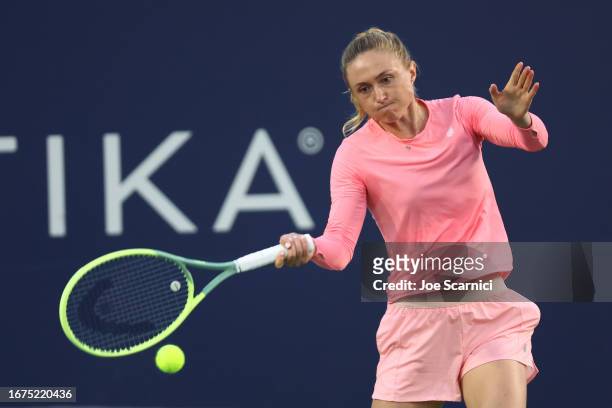 Aliaksandra Sasnovich of Belarus plays a forehand during the first set against Belinda Bencic of Switzerland at the Cymbiotika San Diego Open at...