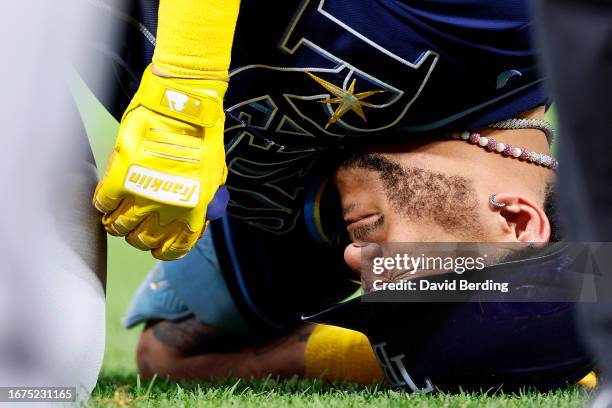 Jose Siri of the Tampa Bay Rays reacts after getting hit by a pitch against the Minnesota Twins in the fifth inning at Target Field on September 11,...