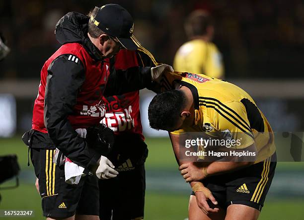 Motu Matu'u of the Hurricanes is helped by a medic after receiving an arm injury during the round 11 Super Rugby match between the Hurricanes and the...