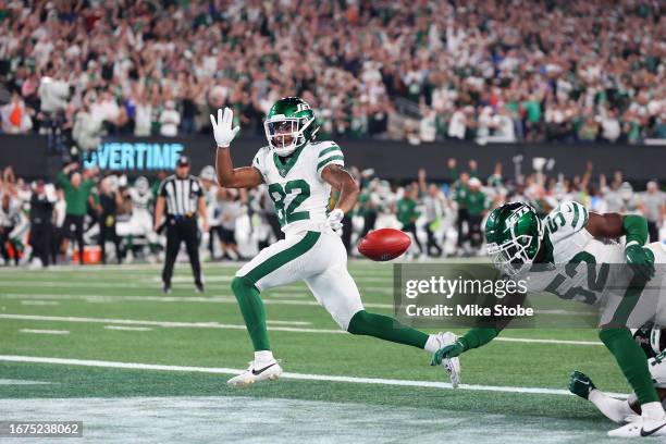 Wide receiver Xavier Gipson of the New York Jets scores the game winning touchdown on a 65-yard punt return during the overtime quarter of the NFL...