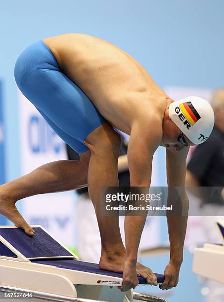 Philipp Forster of SC Wiesbaden 1911 takes the start of the men's 200 m individual medley heat during day one of the German Swimming Championship...