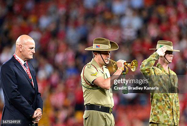 Soldier plays the last post in memory of ANZAC day before the round 11 Super Rugby match between the Reds and the Blues at Suncorp Stadium on April...
