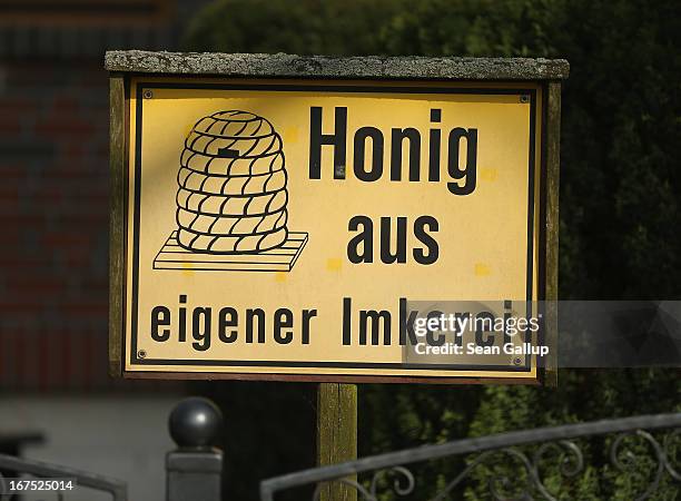 Sign reads: "Honey from of own apiary" outside the home of beekeper Reiner Gabriel near Berlin on April 25, 2013 in Blankenfelde, Germany. Local...