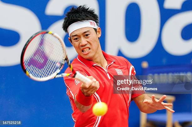 Kei Nishikori of Japan returns the ball against Albert Ramos of Spain during day five of the 2013 Barcelona Open Banc Sabadell on April 26, 2013 in...