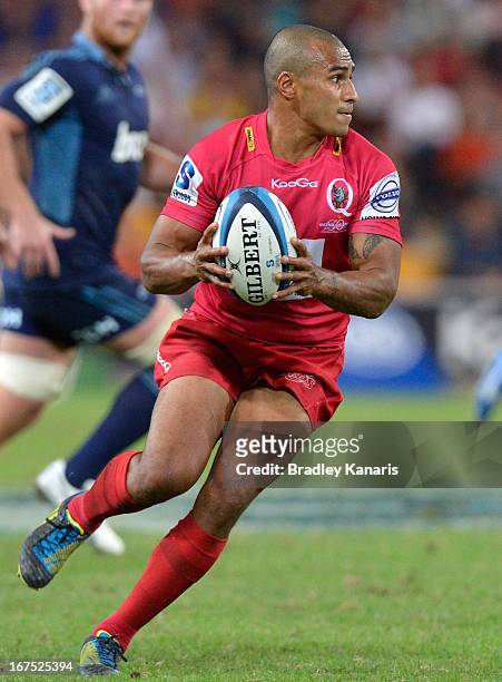 Will Genia of the Reds looks to pass during the round 11 Super Rugby match between the Reds and the Blues at Suncorp Stadium on April 26, 2013 in...