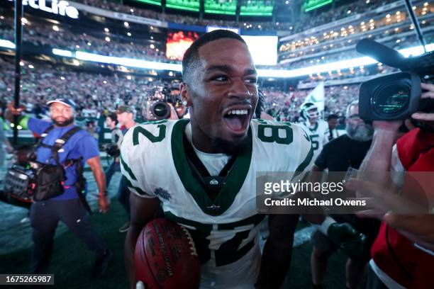 Xavier Gipson of the New York Jets celebrates with teammates after scoring a touchdown off of a punt return to defeat the Buffalo Bills in overtime...