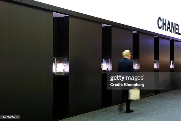 Visitor passes the Chanel Inc. Watch and jewelry booth during the Baselworld watch fair in Basel, Switzerland, on Thursday, April 25, 2013. The...