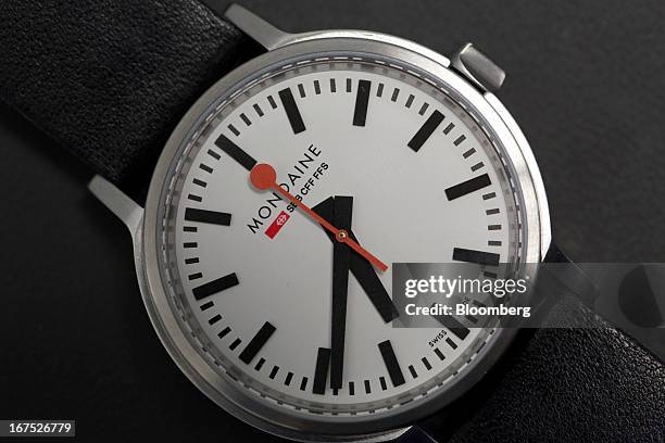 The red and black hands of a stop2go wristwatch, manufactured by Mondaine Watch Ltd. Are seen during the Baselworld watch fair in Basel, Switzerland,...
