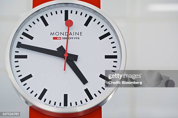 Wall clock in the design of Swiss state-owned railway operator SBB, manufactured by Mondaine Watch Ltd. Hangs on a wall during the Baselworld watch...